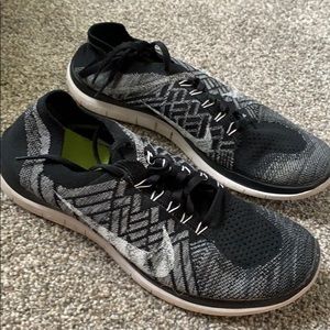 Black and white nike running shoes